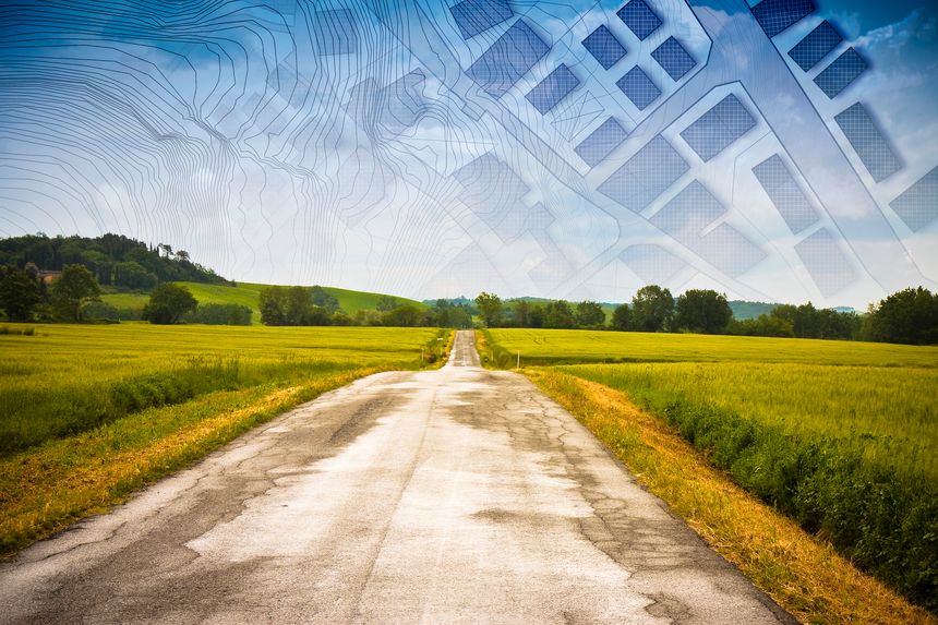 From nature to a new city - concept image with a rural scene that fades on the map of an imaginary city map with buildings and roads - nature becomes a city.