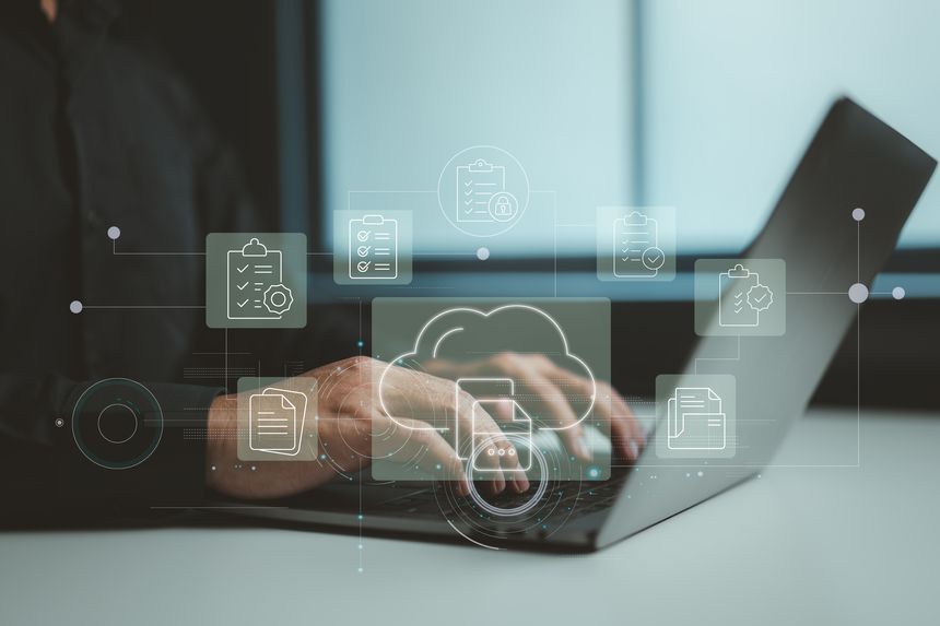 A person working on a laptop with cloud-based checklists and files, symbolizing efficient online data handling.
