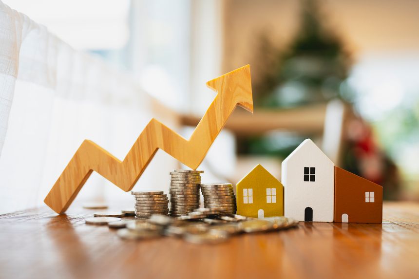Wood house, up arrow and row of coin money on wood table and , selective focus, Planning to buy property. Choose what's the best. A symbol for construction ,ecology, loan concepts.