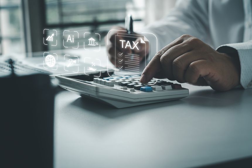 Businessmen using online personal income taxes payment calculators, and laptop computers to fill out tax refund forms. Calculation of personal and business income tax