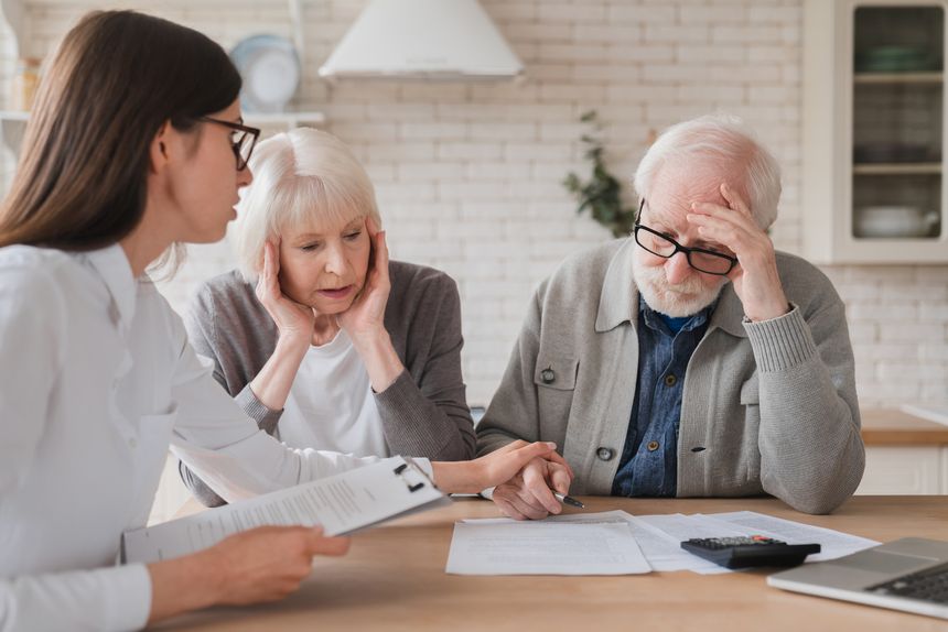 Emotional mental support. Financial adviser consulting senior elderly grandparents couple showing debts, bunkruptcy, negative test results, mortgage, divorce certificate contract pension at home