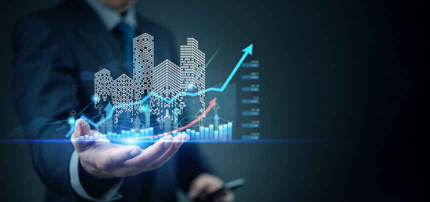 Business hand showing futuristic skyline with finance graph, smart city concept, economic growth, investment planning, real estate tech, digital economy, data trend.