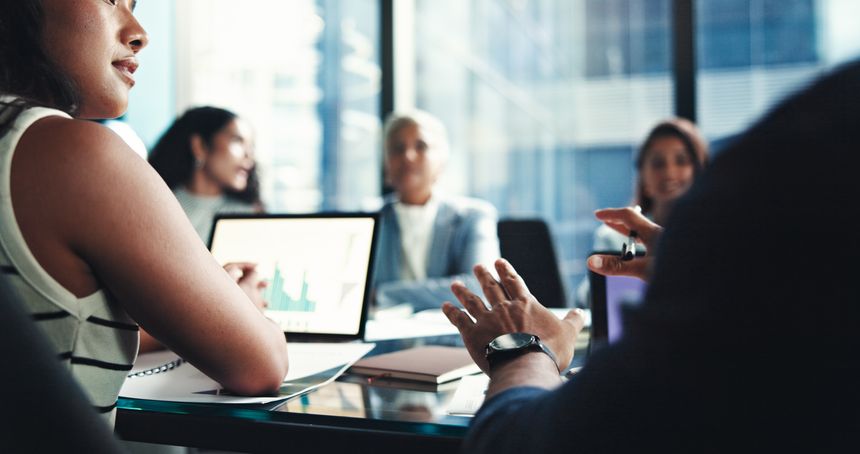 Finance, hands and laptop screen with business people in office boardroom for investment opportunity. Growth, portfolio and proposal with financial colleagues in workplace for wealth management