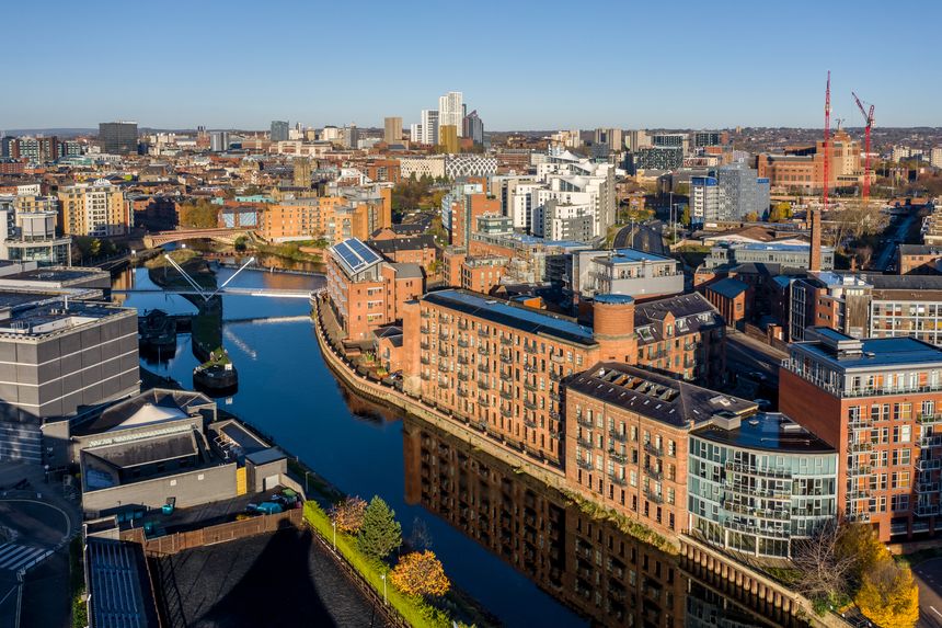 Leeds, UK - November 22, 2021. An aerial panorama cityscape of Leeds city centre skyline with luxury waterfront properties at Robert's Wharf