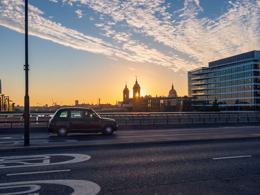 Taxi cab crossing London Bridge, UK