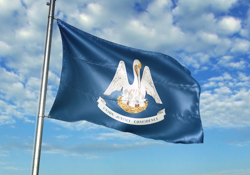 Louisiana state of United States flag on flagpole waving cloudy sky background realistic 3d illustration