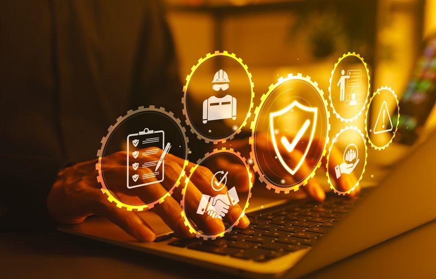 Work Safety and Compliance Concept. hands typing on a laptop with icons work safety, compliance, risk management, operational efficiency, health protocols, workplace regulatory, and safety standards.