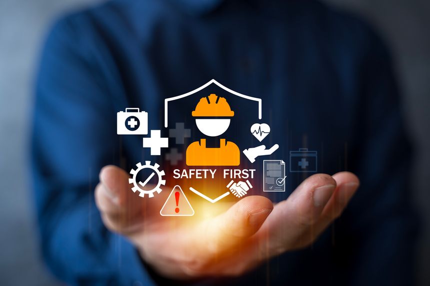 A person holding safety icons with helmet, health, protection symbols representing workplace safety, accident prevention, occupational health, risk management, industrial safety responsibility concept