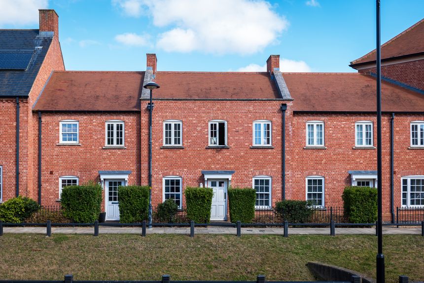 traditional detached house within residential estate in England UK.