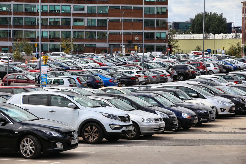 Large parking lot with parking meters in Leeds, UK. Leeds urban area has 1.78 million population.