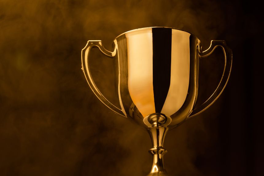 Gold Trophy competition in the dark with smoke and with copy space