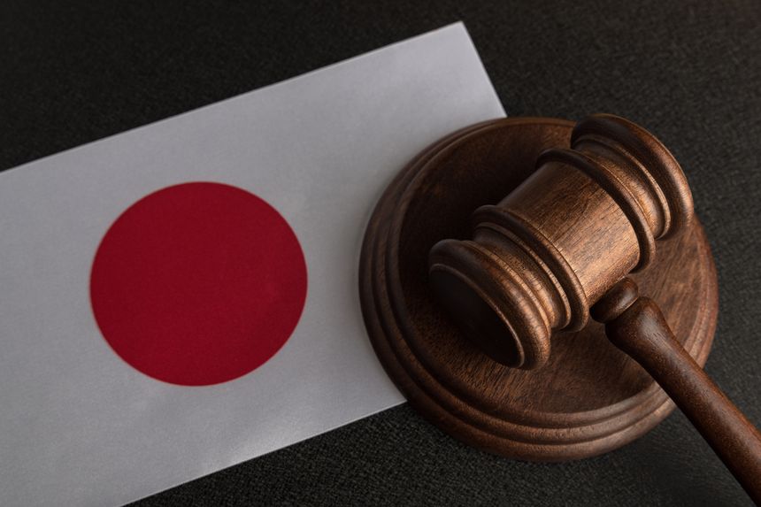 Judge wooden gavel and flag of Japan. Law and justice. Legality concept.