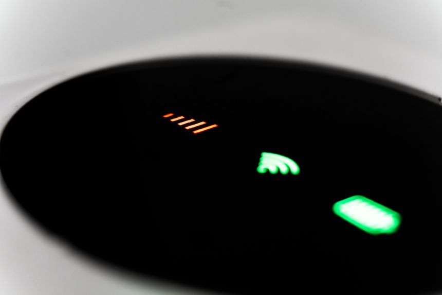 Minimalist technology display showcasing connection and power status with glowing indicators.