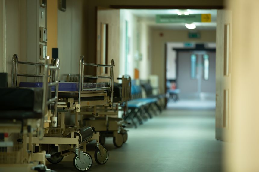 along an empty hallway of a hospital, void of the chaos we see today