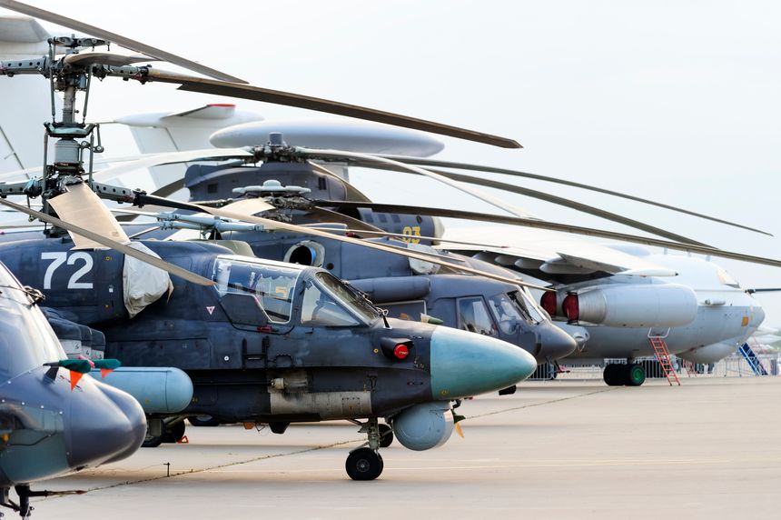 Helicopters and planes in row, military copters and bomber jets and reconnaissance aircrafts, air force, modern army aviation and aerospace industry