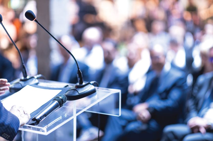 Public speaker at business conference, corporate presentation, workshop, coaching training, news conference, company meeting, public or political event