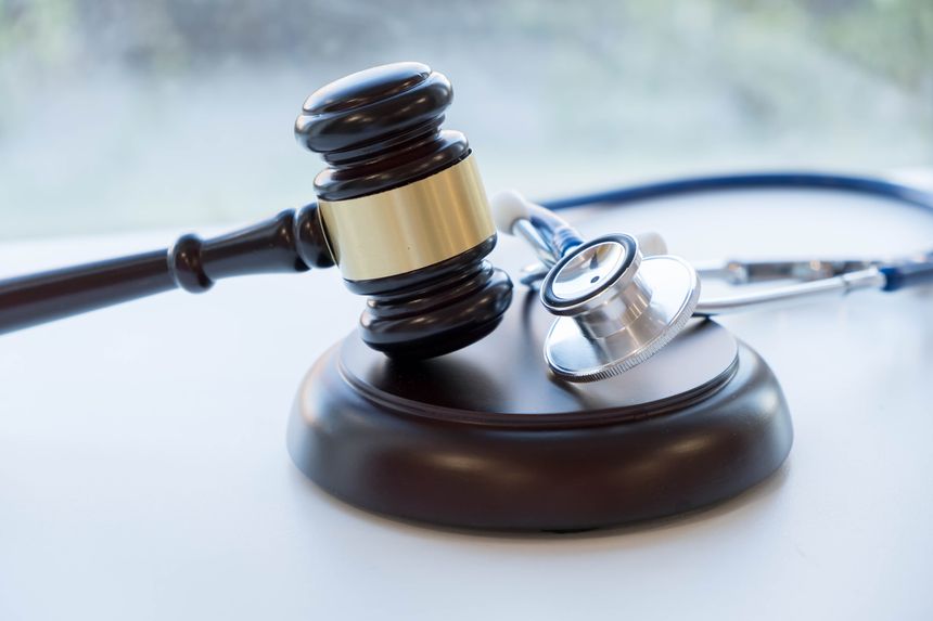 Gavel and stethoscope. medical jurisprudence. legal definition of medical malpractice. attorney. common errors doctors, nurses and hospitals make.
