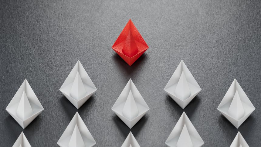 Different business concept.new ideas. paper art style.Leadership concept with red paper ship leading among white boats.3D rendering on black background.