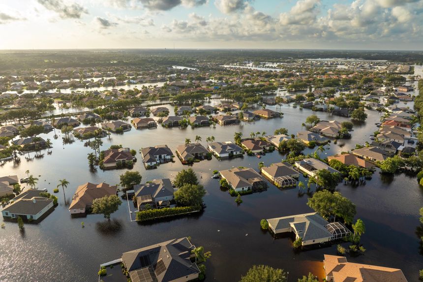Flooded houses from hurricane rainfall water in Florida residential community. Aftermath of natural disaster in USA south.