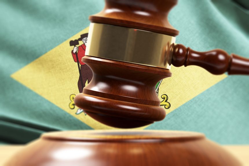 Wood Gavel Standing Front Of the Delaware State Flag Closeup 3d Render Focused image