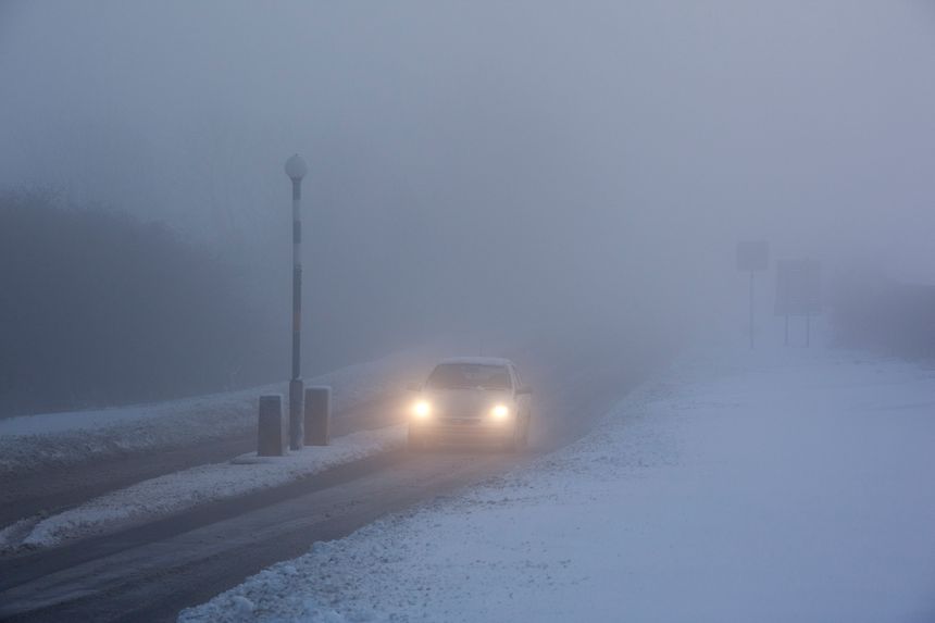 Winter driving in freezing fog on a country road in Yorkshire in the United Kingdom.