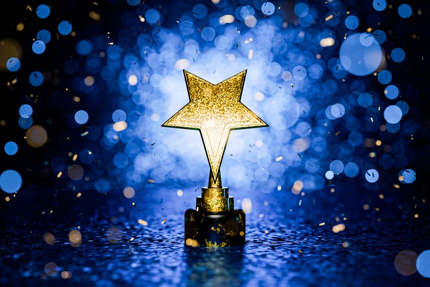 First place in a computer game. Winner certificate. Gold star on a blue background as a reward. Top Performance Award. Winners Cup. Achievements. Victory. Goal achievement concept. 3D render.