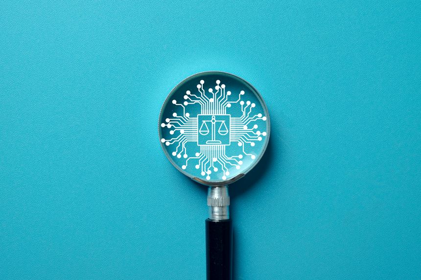 Focus on AI ethics. Magnifying glass analyzing scales of justice on an AI chip, symbolizing regulation, digital law, and the ethics of artificial intelligence. Blue background.