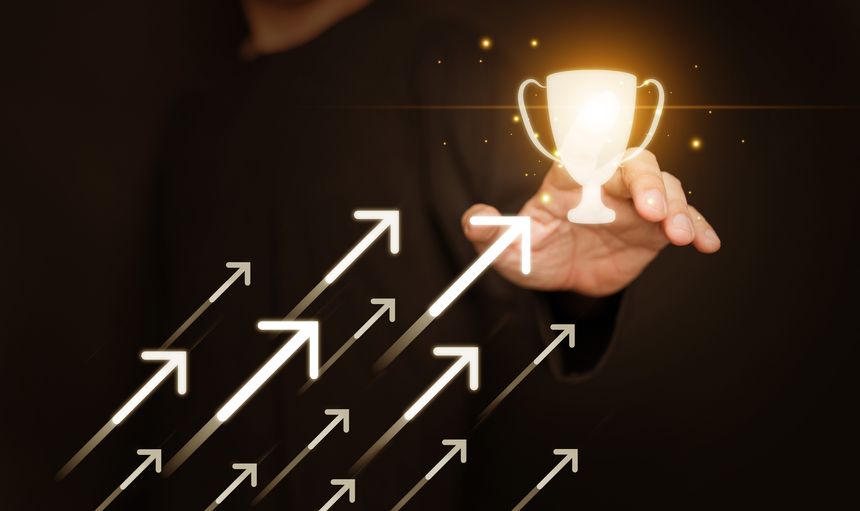 Growth and success concept with a hand guiding arrows towards a glowing trophy. Achievement, business progress, motivation, personal development, self improvement, professional goal, and leadership.