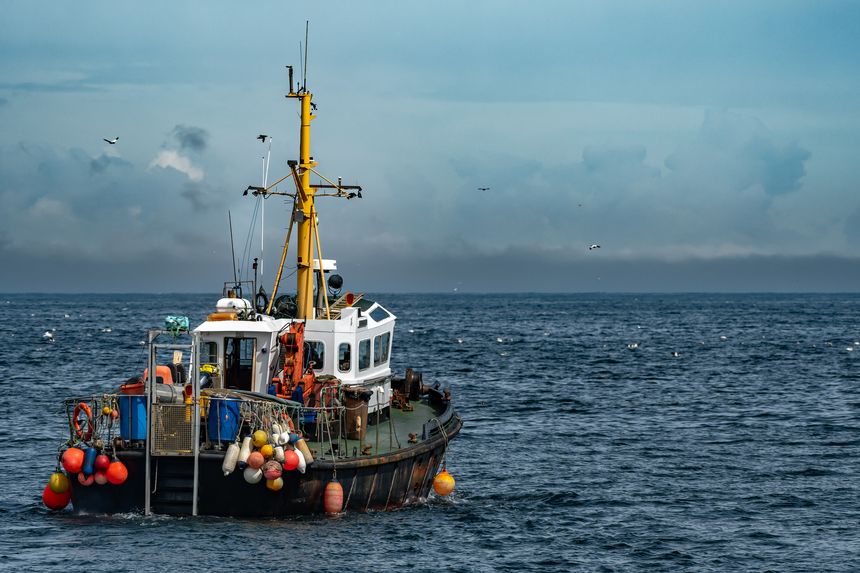 Commercial Fishing Trawler On The Calm Water Of The Atlantic Ocean In Scotland, UK