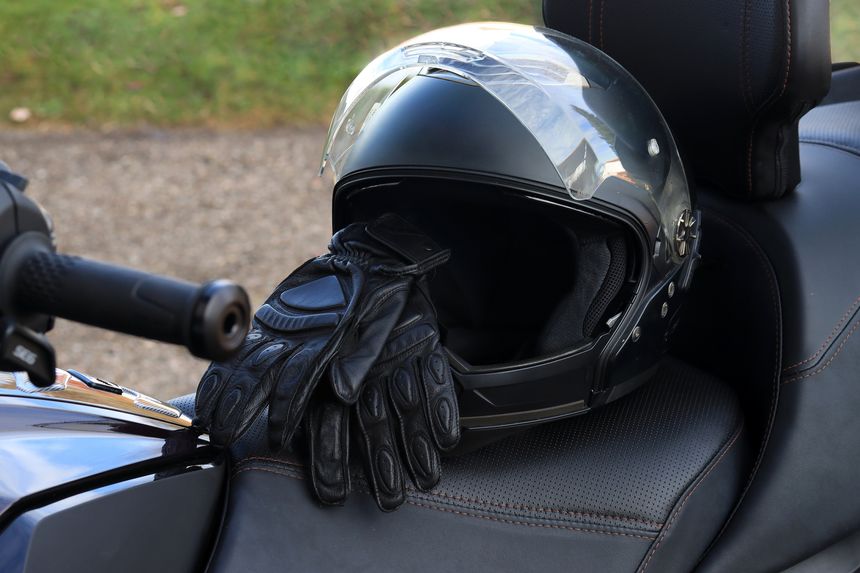 Motorcycle helmets and gloves ensure safety in motorsports. Motorcycling with protective gear