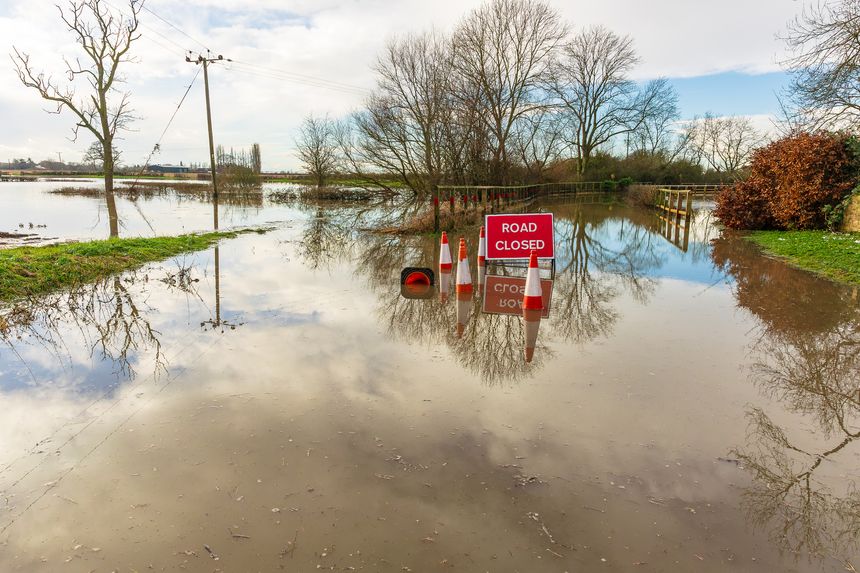 Severe flooding on the B1223 road between the rural villages of Ryther and Cawood near Selby in North Yorkshire with water from the River Wharfe spilling over into agricultural fields.  Copy space
