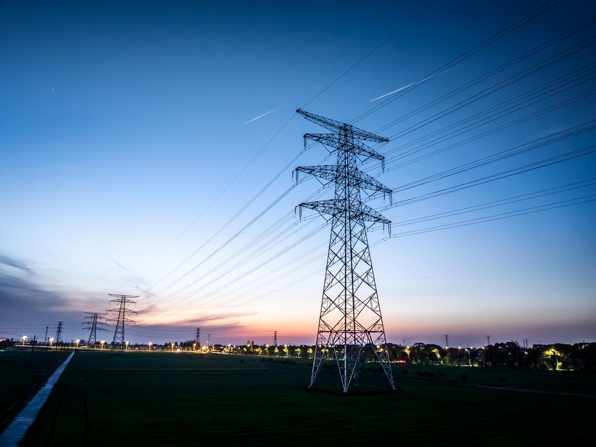 High voltage electricity tower landscape at sunset
