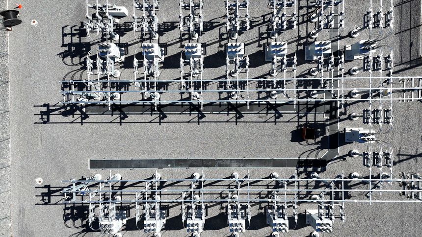 Aerially passing over an array of electrical components associated with an electrical substation