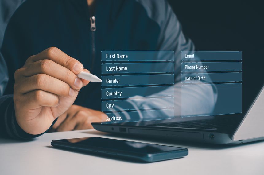 Filling your information. Register your personal data details information, Business people fill online application form with name, email, address, phone number and date of birth for registration.
