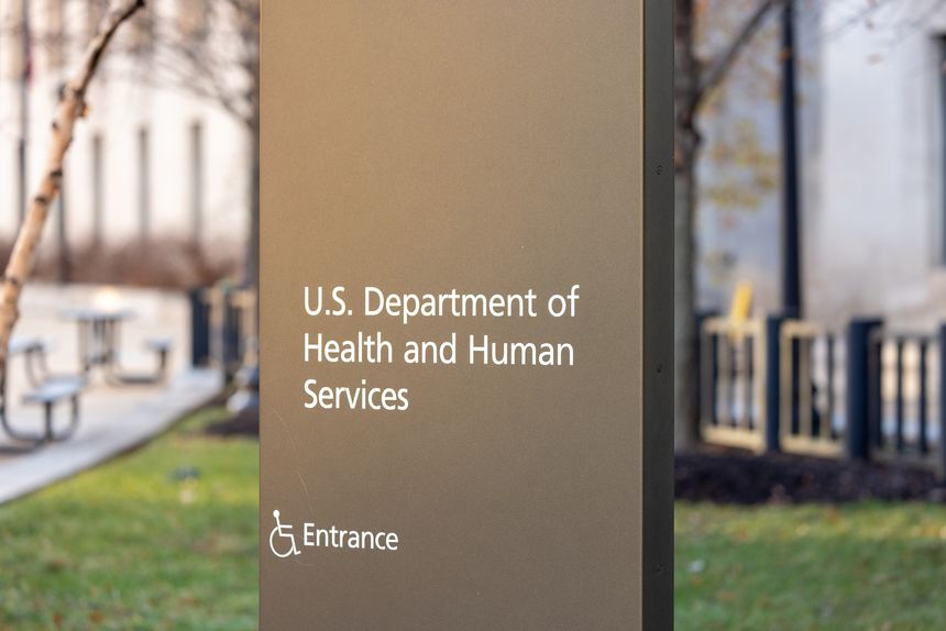 Washington, DC: US Department of Health and Human Services signage on street outside building entrance