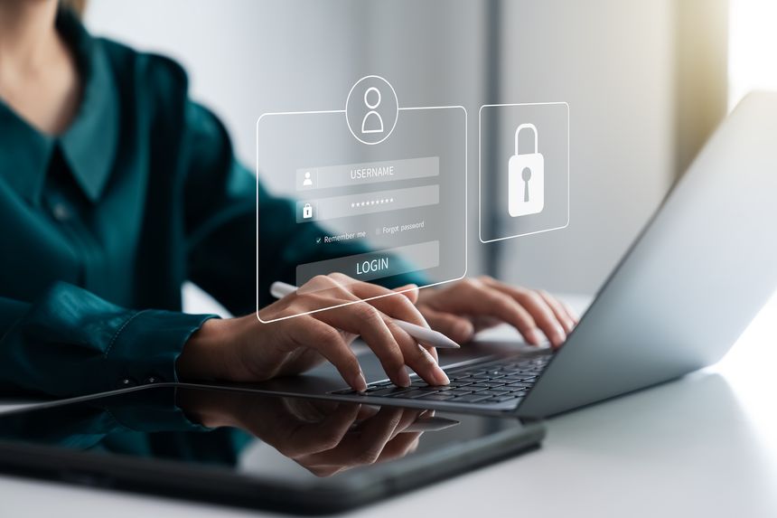 Securing cybersecurity, A Businesswoman protecting personal data on laptops and virtual interfaces, Preventing Online Theft, Cybersecurity concepts.