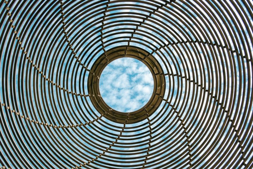 spiral grid with a view of the cloudy sky