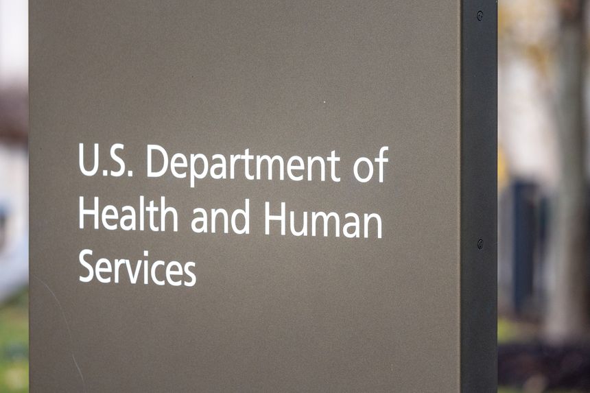 Washington, DC: US Department of Health and Human Services signage on street outside building entrance