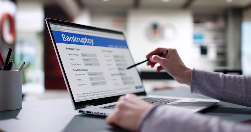 Woman Lawyer Filling Bankruptcy Form on Laptop, Insolvency Notice Online