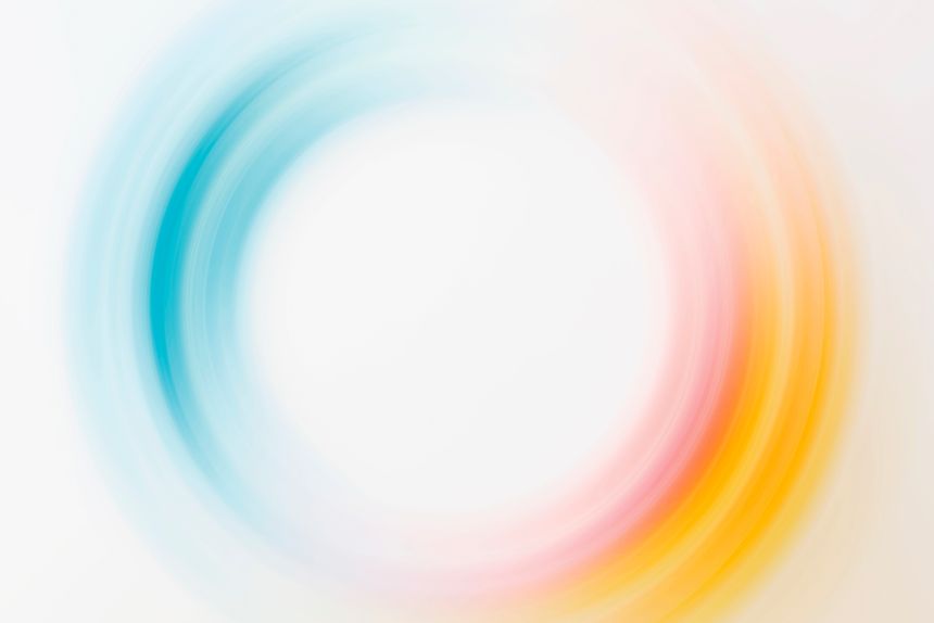 abstract background with blue, yellow, orange and red rays.