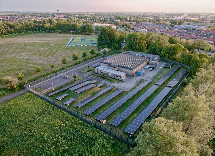 Goes, Netherlands - August 08, 2025: Aerial view of small local data center in the Netherlands with a lot of solar panels, online cloud storage locally