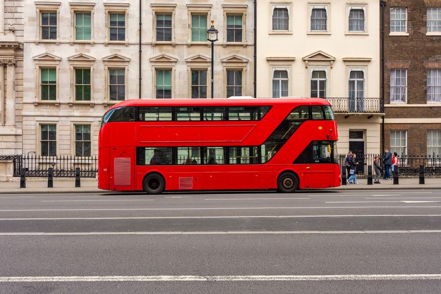 Red double-decker bus on streets of London, UK