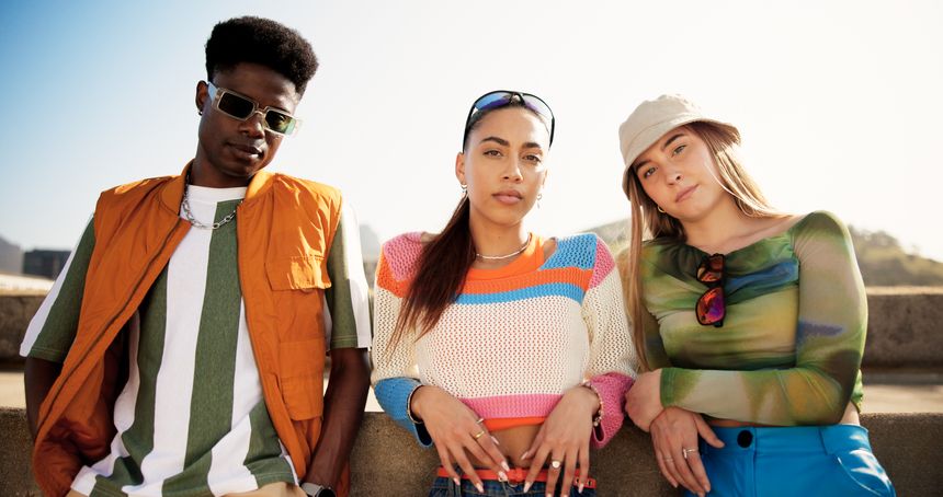 City, group and friends in portrait for fashion, streetwear and bonding together with gen z style. Diversity, man and women on bridge for summer clothes, sunglasses or reunion with confidence outdoor