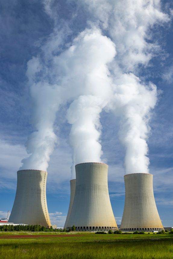 Cooling towers of Temelin Nuclear Power Station releasing steam into the atmosphere near Knin village, Czechia