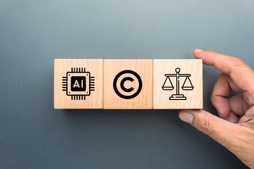 Wooden blocks showing AI chip copyright and justice scale icons symbolizing artificial intelligence copyright law ethics and regulation concept