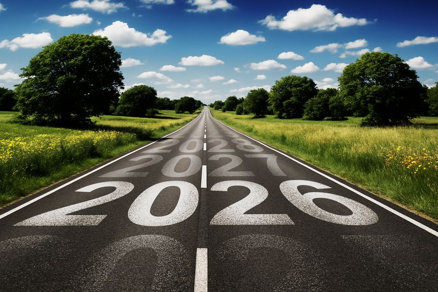 A long road stretches toward the horizon, marked with upcoming years symbolizing progress, ambition, and the endless journey toward tomorrow.