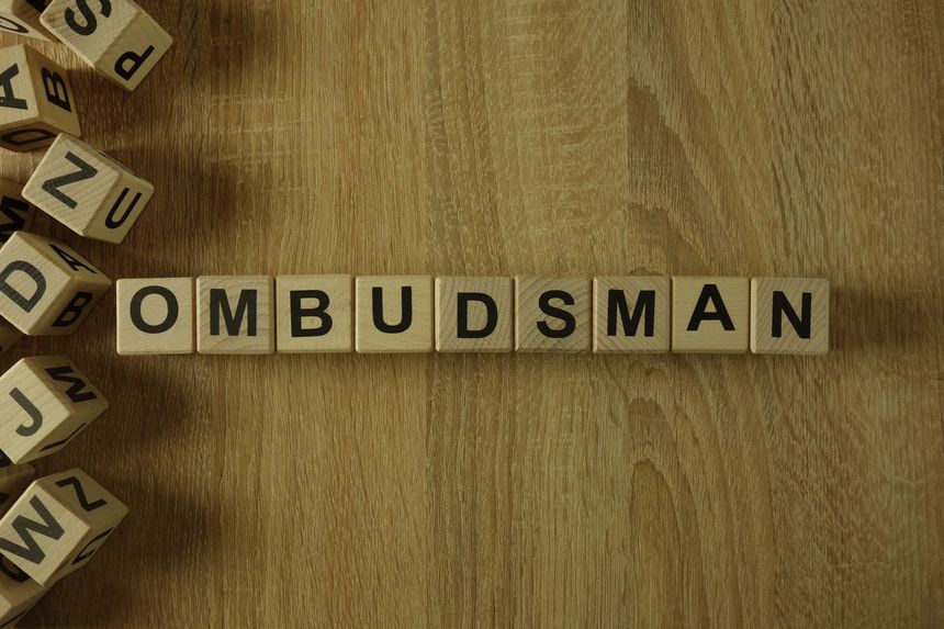 Ombudsman word from wooden blocks on desk