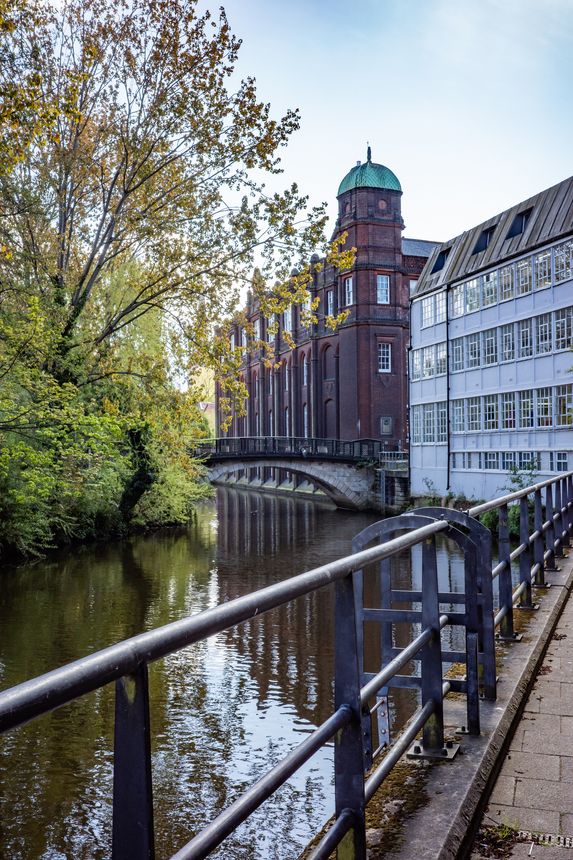 A view along the developed River Wensum on a bright and sunny morning