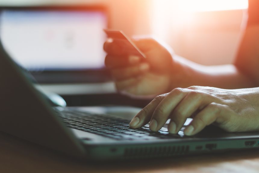 Online shopping concept. Businessman holding credit card and typing on laptop for online shopping and payment makes a purchase on the Internet, Online payment, Business financial and technology.