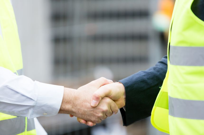Successful handshake deal at construction site
